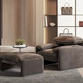 Comfortable Single Sofa with Matching Ottoman on Gray Rug and Wooden Wall Decor
