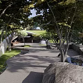 Garden Landscape Design Featuring Trees Paved Pathway Wooden Pavilion and Water Feature