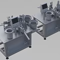 Stainless Steel Industrial Equipment Featuring LCD Screens And Cylindrical Hoppers On Metal Workbenches