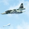 Camouflage Fighter Jet With Red Tail Emblem Launching Missile In Blue Sky