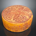 Intricately Carved Circular Decorative Box With Floral Patterns And Ornate Designs