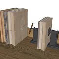 Stacked Books And Magazines Bound With String And Black Bookends On Wooden Floor