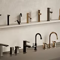 Stylish Modern Faucets In Black Gold Colors And Various Designs Displayed On Shelves