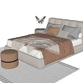 Modern Cozy Double Bed With Beige Headboard Brown Bedding And Decorative Pillows