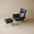 Black Leather Leisure Chair with Matching Ottoman and Metal Legs in Modern Minimalist Setting