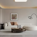 Warm Modern Minimalist Living And Dining Room With Soft Sectional Sofa And Curved Floor Lamp