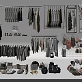 Various Stylish Clothes with Hanging Jackets Pants Folded Items and Accessories on Racks