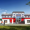 Traditional Chinese Style Entrance Gate With Red And White Building And Green Lawn