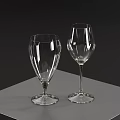 Two Elegant Transparent Wine Glasses Placed On Grey Table Against Dark Background