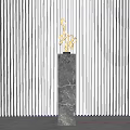Decorative Ornament Set With Golden Sculpture On Black Marble Pedestal Against Gray Striped Wall