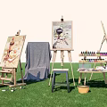 Artistic Outdoor Setup With Easels Paintings Brushes Colorful Paint Tubes Musical Instruments On Green Grass