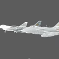 Three Military Fighter Jets Flying in Formation Against Clear Sky