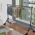 Metal Clothes Rack Hanging Various Colored Clothes With Storage Box On Wooden Bedroom Floor