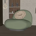 Light Green Single Sofa With White Floral Cushion And Metal Base In Modern Living Room
