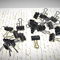Pile of Black Binder Clips as Practical Daily Supplies on Paper with Text