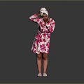 Pink Floral Bath Robe With White Towel On Head Standing Against Gray Background