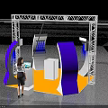 Exhibition Booth With White Metal Frame Blue Curved Structures Orange Floor And Woman At