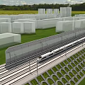 Railway Fence Along High Speed Train Track With Green Grass And White Buildings