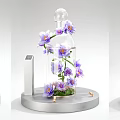 Elegant Floral Display with Purple Flowers in Glass Container on Modern Pedestal