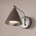 Modern Wall Lamp With Conical Shade And Curved Arm On Light Colored Wall