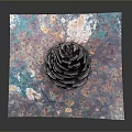 Detailed Pinecone Resting On Colorful Patterned Paper Against Gray Background