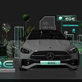 White Mercedes EQE Electric Vehicle Display With Green Plants And Brand Signage