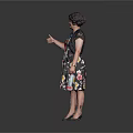 Woman Wearing Black Dress With Colorful Patterns Black Hat Lanyard Thumbs Up And Holding Paper