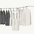 Soft Dark and Light Knitted Clothes Hanging on a White Clothes Rack