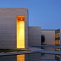 Modern Architectural Courtyard With Pool Statue Grass And Blue Sky