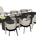Elegant Modern Table And Chairs Set With Upholstered Seats Flower Vase And Books