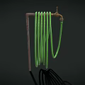 Brass Faucet with Green Coiled Hose on Dark Background and Shadow Detail