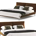 Modern Double Bed With Brown Upholstered Headboard White Sheets Black Comforter And Green White Pillows