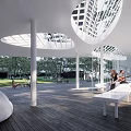 Modern Residential Entrance Gate Surrounded by High-Rise Buildings Trees Lawn Paths and Leisure Chairs