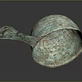 Ancient Bronze Spoon With Ornate Carved Patterns And Curved Handle Design