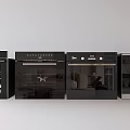 Four Black Ovens Arranged Side by Side as Modern Kitchen Appliances