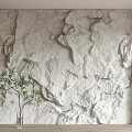 White Textured Stone Bedroom Accent Wall With Wooden Panels And Green Plant Vase