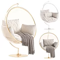 Round Golden Frame Hanging Chair With White Cushions And Gray Blanket