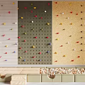 Sports Equipment For Climbing Wall With Colorful Holds And Safety Mats