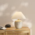 Ceramic Table Lamp With Speckled Beige Cream Linen Shade Camera And Book On Wooden Desk