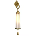 Elegant Brass Wall Sconce With Cylindrical Glass Shade And Soft Lighting