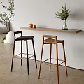 Modern Bar Counter Interior With Wooden And Black Stools Shelf And Green Plants