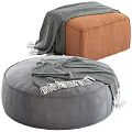 Round Gray and Square Brown Ottomans with Fringed Blankets on Top