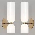 Modern White Cylindrical Wall Lamp with Gold Metal Base on Gray Wall