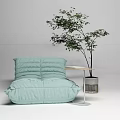 Light Green Bean Bag Sofa With Small Side Table Book And Potted Plant