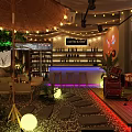 Inviting Indoor Cafe Lounge With String Lights Decorative Tree Stone Path And Glowing Lights 3d model