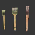 Three Old Brushes Of Various Sizes With Wooden Handles And Worn Bristles On White Background