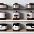Various Styles of Kitchen Appliances Rice Cookers Displayed on Shelves