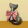 Black Cat Ornament With Large Red Bow Photo Spot On Light Yellow Brown Gradient Background