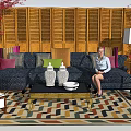 Sofa Coffee Table Set with Colorful Cushions White Vases Wooden Shutters and Geometric Rug