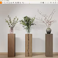 Three Vases Pink Transparent Glass And Gray With Flowers On Wooden Pedestals White Wall